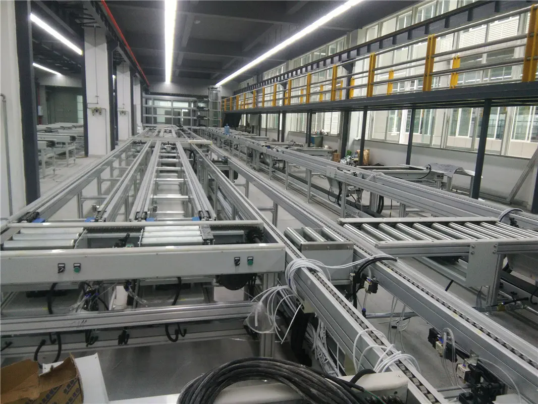 智能水表裝配線企業所屬行業：電子行業, 改造后效果：  （1）整線連線式作業降低物料周轉提高效率。  （2）后端無人化自動包裝  （3）產品合格率從原來95%，改造后是99.2%；,